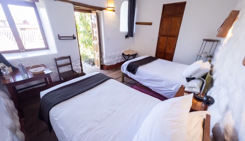 Habitación con 2 camas individuales, en la zona del jardín