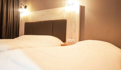 Habitación triple, varias camas
