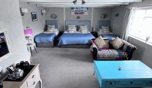 Habitación cuádruple Deluxe, varias camas