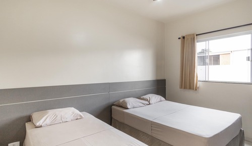 Habitación triple, varias camas