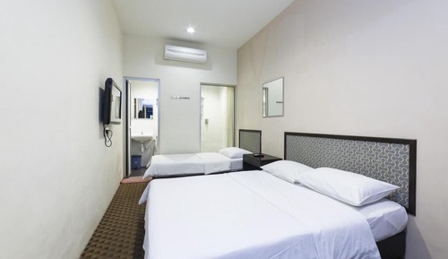 Habitación triple familiar, varias camas