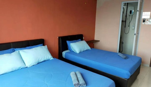 Habitación triple, varias camas