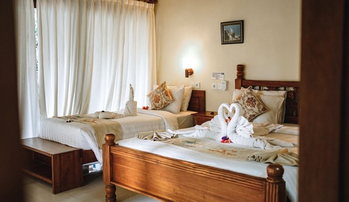Habitación triple Deluxe, frigorífico, vistas al jardín