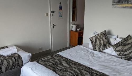 Habitación triple, vistas al mar