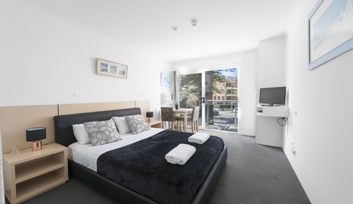 Suite Deluxe, 1 cama de matrimonio, balcón, vistas parciales al mar
