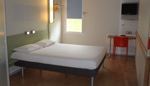 Habitación triple, varias camas