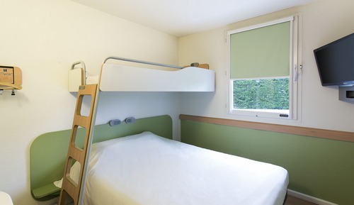 Habitación triple, varias camas