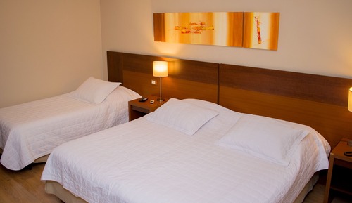 Habitación triple, varias camas