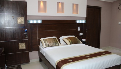 Habitación Deluxe con 1 cama doble o 2 individuales, varias camas, cocina básica