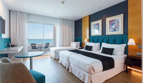 Habitación triple, vistas al mar