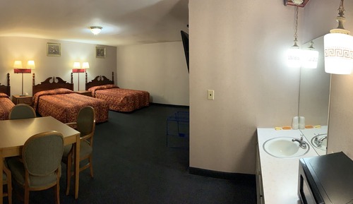 Habitación triple, varias camas