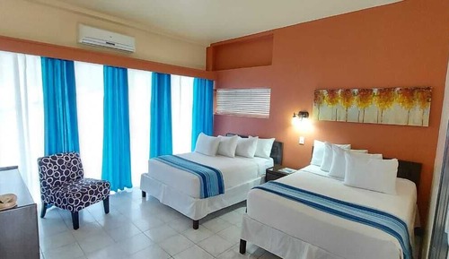 Habitación superior, 2 camas dobles, vistas al jardín