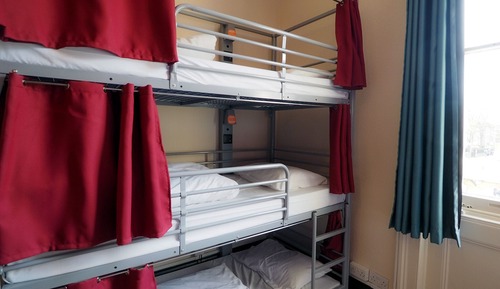 Bed in 9 Bed Dorm with Shared Bathroom (Triple Bunks)