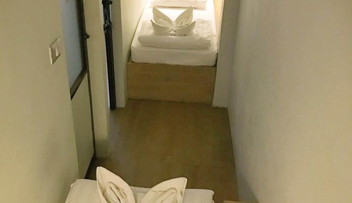 Twin Bed with Shared Bathroom