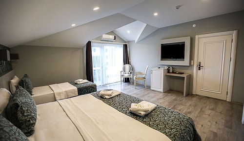 Habitación triple, vistas al mar