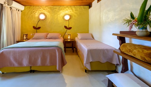 Habitación triple Confort, patio, en la zona del jardín