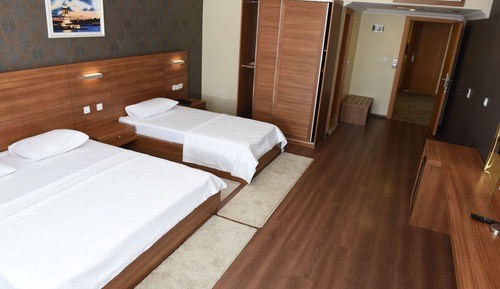 Habitación triple Deluxe, varias camas
