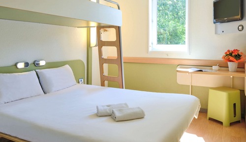 Habitación triple, varias camas