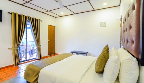 Habitación Deluxe con 1 cama doble o 2 individuales, baño privado