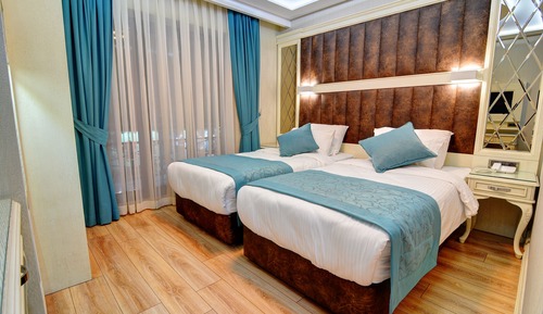 Habitación superior con 1 cama doble o 2 individuales