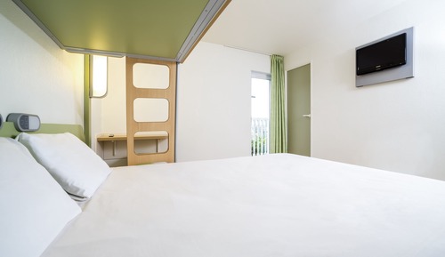 Habitación triple, varias camas