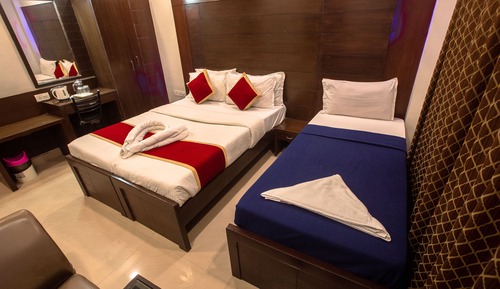 Habitación Business triple, varias camas