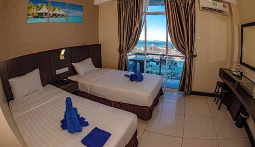 Habitación superior con 2 camas individuales, vistas al mar