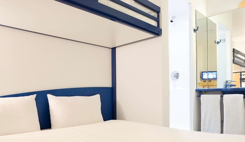 Habitación triple, varias camas
