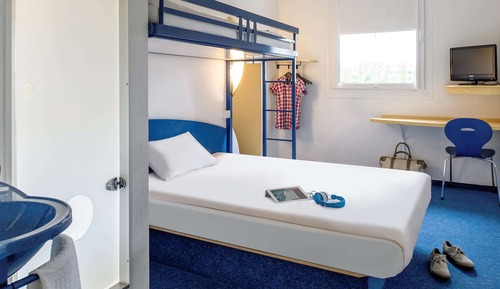 Habitación triple, varias camas