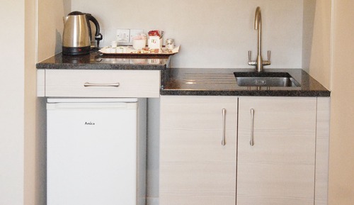 Habitación cuádruple familiar, cocina básica