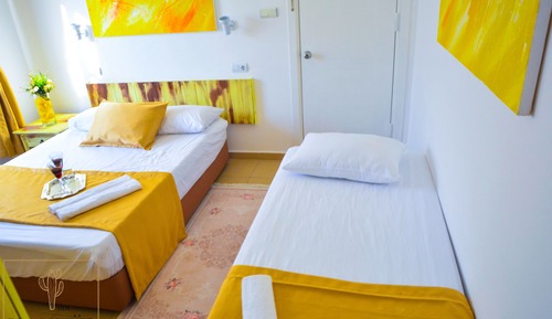 Habitación triple Deluxe, varias camas