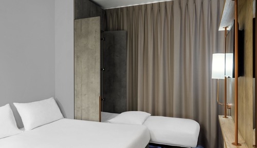 Habitación triple, varias camas