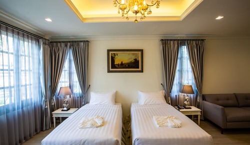 Suite junior, 2 camas individuales, baño privado, en esquina