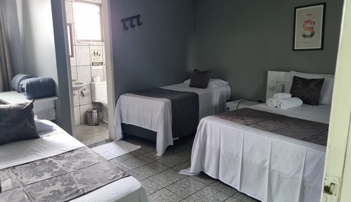 Habitación triple, varias camas
