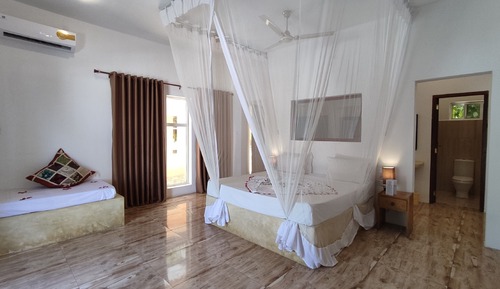 Habitación triple Deluxe, vistas al jardín