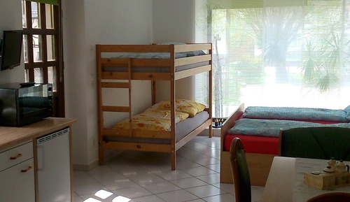 Habitación cuádruple familiar, varias camas, no fumadores, vistas al jardín