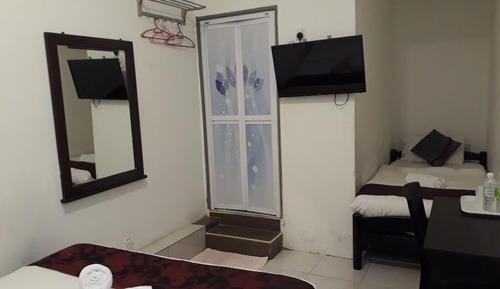 Habitación triple Deluxe (With Window)