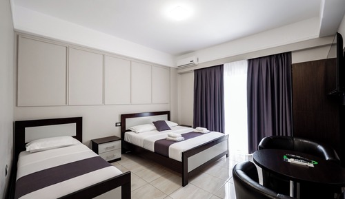 Habitación triple, vistas al mar
