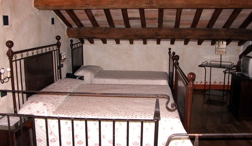Habitación triple superior, en la zona del jardín