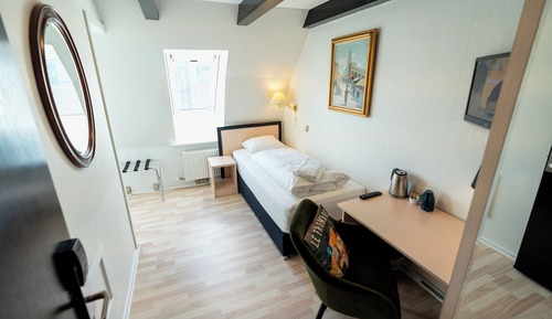 Economy single room, Small bathroom, note stairs to floor