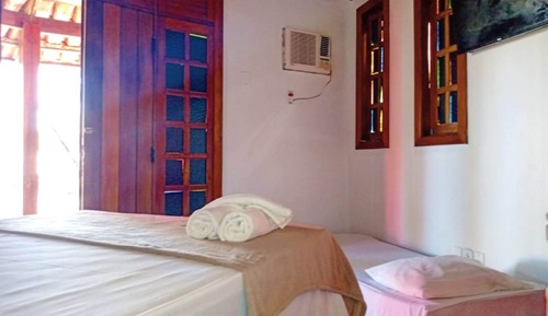 Habitación triple, varias camas