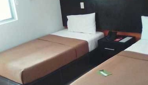 Habitación triple, varias camas