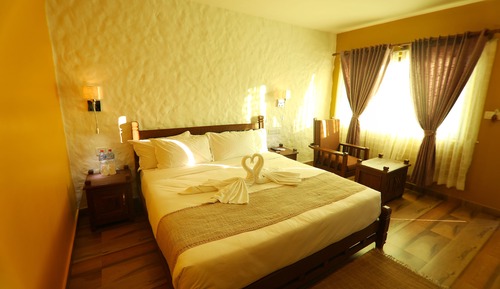 Habitación Deluxe con 1 cama doble o 2 individuales, en la zona del jardín