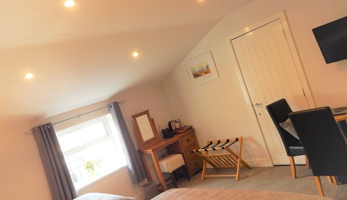 Habitación triple Deluxe, varias camas