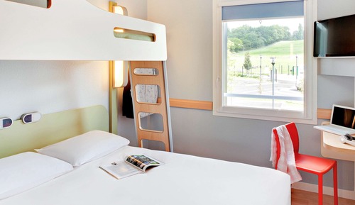 Habitación triple, varias camas