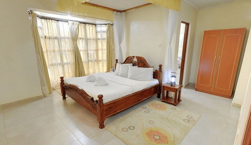 Suite ejecutiva, 1 cama de matrimonio grande, vistas al jardín