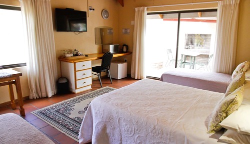 Habitación cuádruple familiar, varias camas, vistas al jardín