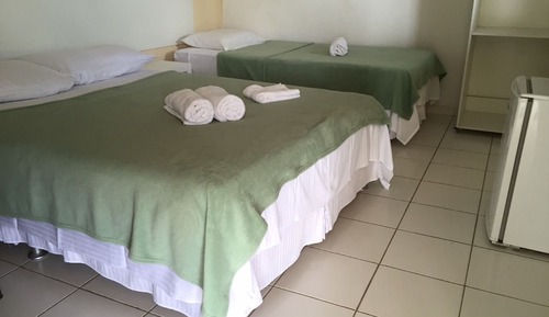 Habitación triple, varias camas