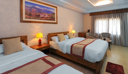 Habitación triple Deluxe, varias camas