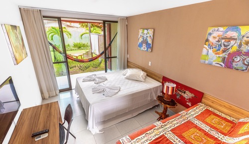 Habitación triple Deluxe, varias camas, vistas al jardín